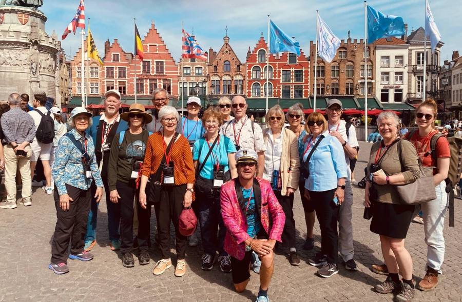 Jay with a happy group of visitors on the Markt Square, Bruges